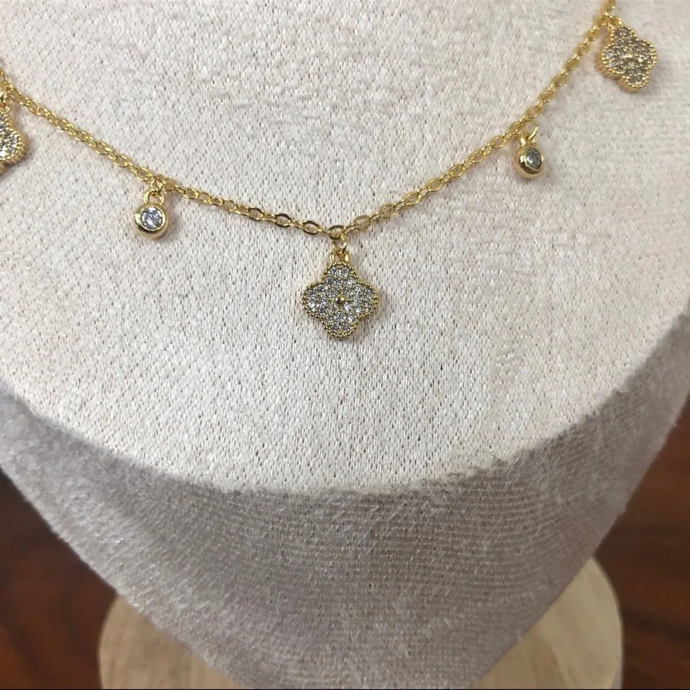 gold dangle station necklace encrusted clover charm round bezel set Cubic Zircon